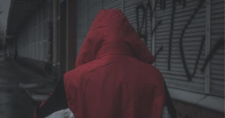 An image featuring a burglar wearing a hoodie
